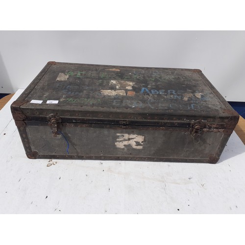 5 - OLD TRAVEL TRUNK CONTAINING LEATHER WORKING TOOLS OFF CUTS 31 x 10 x 17 inches