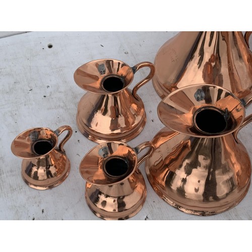 501 - 7 GRADUATED COPPER JUGS