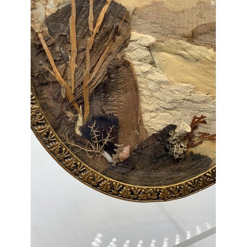 605 - AN OVAL BRASS PICTURE FRAME HAND CRAFTED FROM NATURE