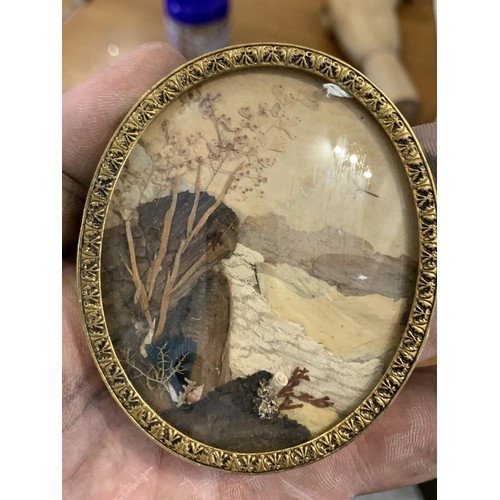 605 - AN OVAL BRASS PICTURE FRAME HAND CRAFTED FROM NATURE