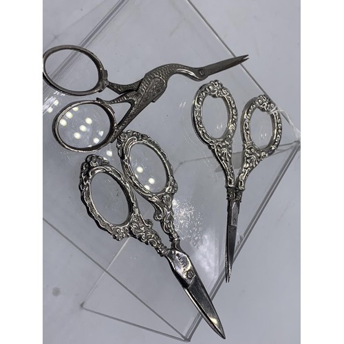 607 - 3 PAIRS OF ORNATE SCISSORS -2X SILVER HANDLED AND 1 STORK HANDLE