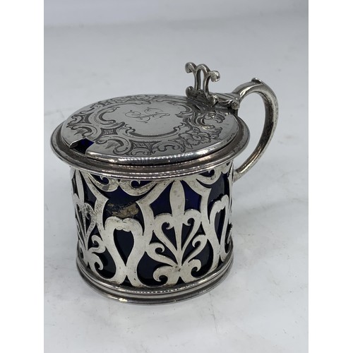 649 - AN ORNATE VICTORIAN LONDON SILVER MUSTARD POT WITH BLUE GLASS LINER silver weight 99.2grms (liner re... 