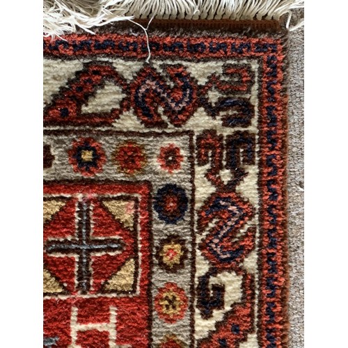 516 - SMALL HAND STICTHED WOOLEN RUG