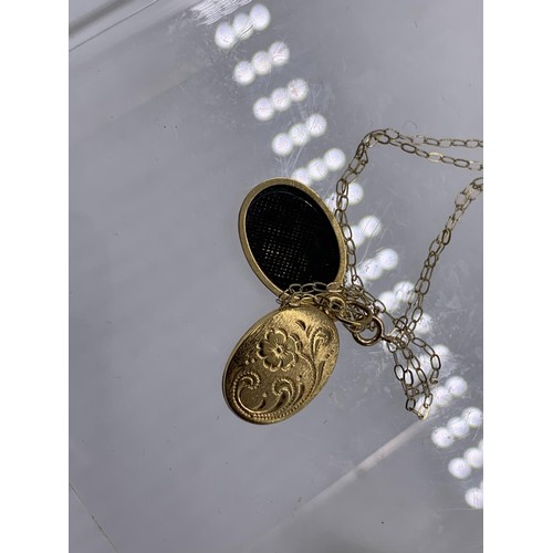 618 - A 9ct GOLD ENGRAVED LOCKET ON A 9ct GOLD CHAIN 1.4grms