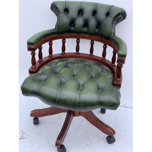 572 - A GREEN LEATHER CAPTAINS CHAIR