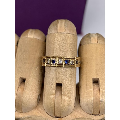 642 - AN ORNATE 9ct GOLD DIAMOND AND SAPPHIRE ETERNITY RING SIZE M/N 3.1grms