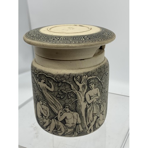 740 - A STONEWARE POT WITH LID SHOWING MUSICAL AND FOREST SCENES 3in Tall