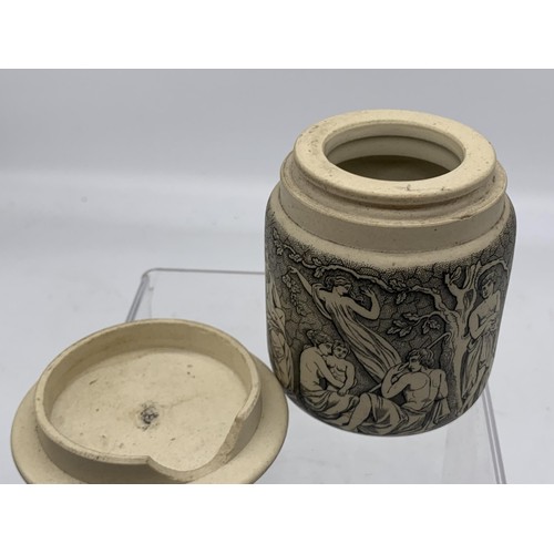 740 - A STONEWARE POT WITH LID SHOWING MUSICAL AND FOREST SCENES 3in Tall