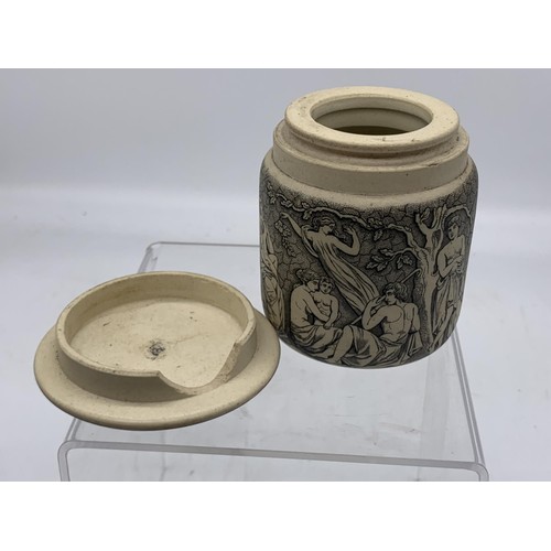 740 - A STONEWARE POT WITH LID SHOWING MUSICAL AND FOREST SCENES 3in Tall