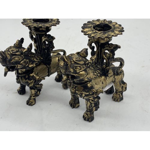 760 - A PAIR OF CHINESE BRASS LION CANDLEHOLDERS 3.5