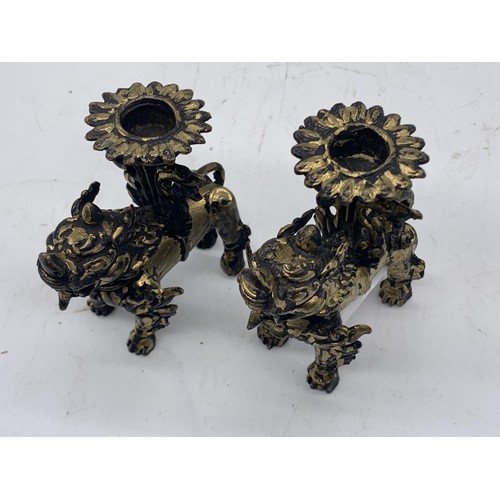 760 - A PAIR OF CHINESE BRASS LION CANDLEHOLDERS 3.5