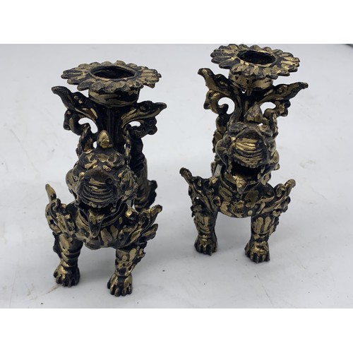 760 - A PAIR OF CHINESE BRASS LION CANDLEHOLDERS 3.5