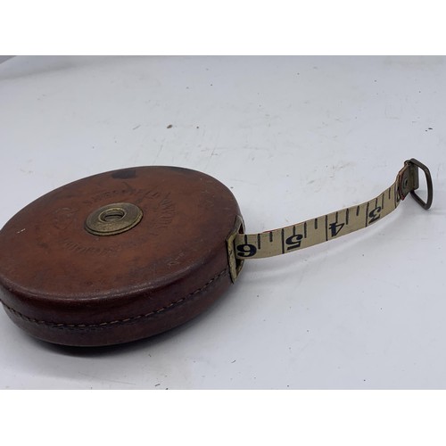 764 - A LEATHER BOUND 66FT BRASS HANDLE SHEFFIELD CHESTERMAN