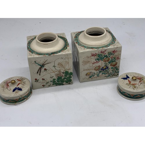 765 - A PAIR OF POTTERY POTS WITH LIDS SHOWING BUTTERFLIES 4X3