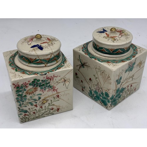 765 - A PAIR OF POTTERY POTS WITH LIDS SHOWING BUTTERFLIES 4X3