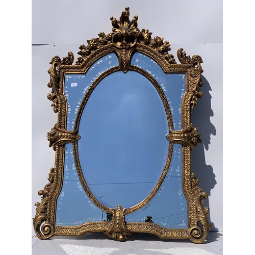 776 - VERY ORNATE GILT DESIGNER STYLE MIRROR 55 x 36