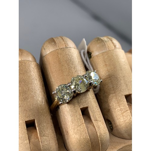 651 - THREE STONE DIAMOND RING APPROX 3ct IN WHITE CLAW MOUNT ON 18ct YELLOW GOLD SHANK 5g K/L CLARITY SIZ... 