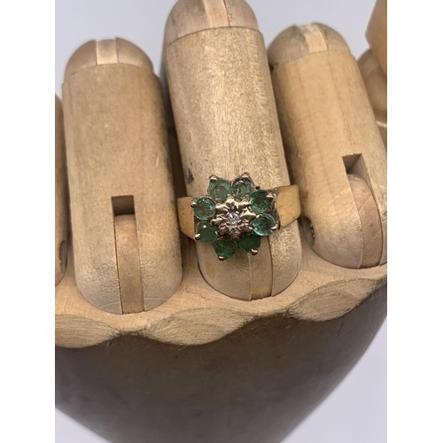 665 - A 9ct GOLD EMERALD AND DIAMOND RING size M/N 3.6grms