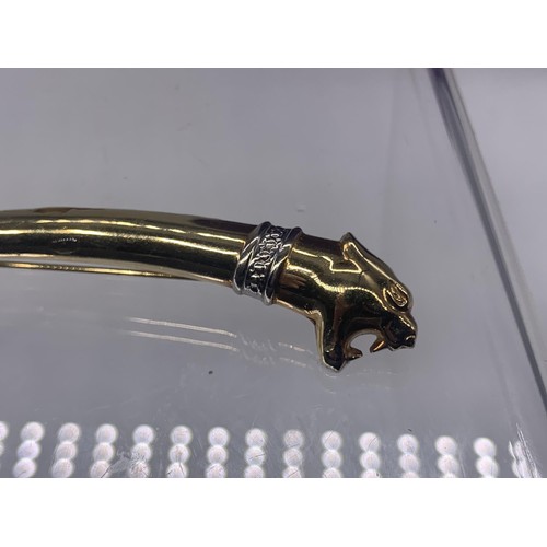 676 - A STUNNING 9ct GOLD (4.6grms) JAGUAR BROOCH