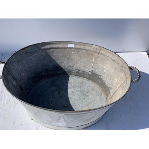 713 - AN OLD 2 HANDLED TIN BATH 28