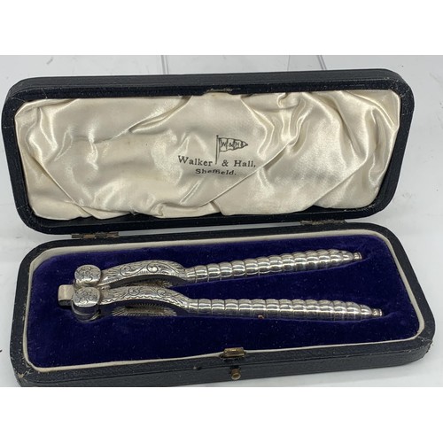 719 - A CASED SET OF ORNATE WALKER AND HALL NUT CRACKERS