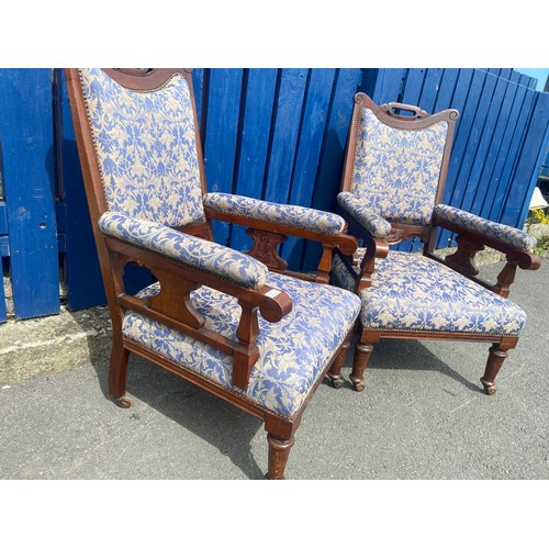 783 - A PAIR OF VICTORIAN WALNUT FRAMED ARMCHAIRS IN A BLUE AND GILT MATERIAL