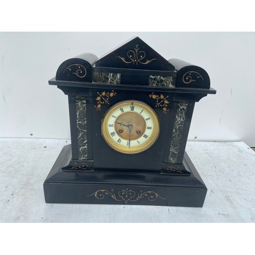 701 - A BLACK POLISHED SLATE MANTLE CLOCK WITH GREEN  POLISHED INLAY AND A PORCELAIN DIAL 14X14