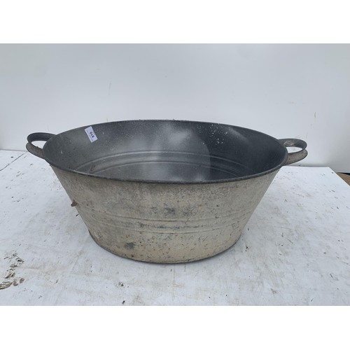 810 - AN OLD 2 HANDLED TIN BATH 20