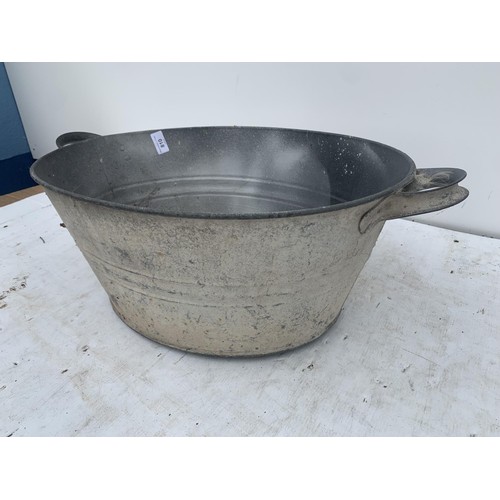 810 - AN OLD 2 HANDLED TIN BATH 20