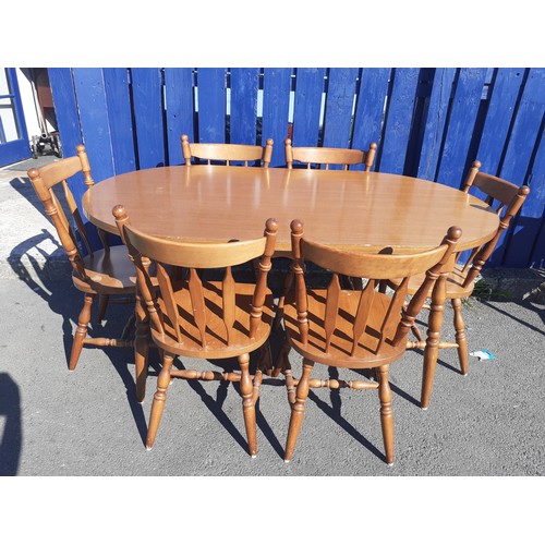 800A - AN OVAL OAK TABLE & 6 CHAIRS