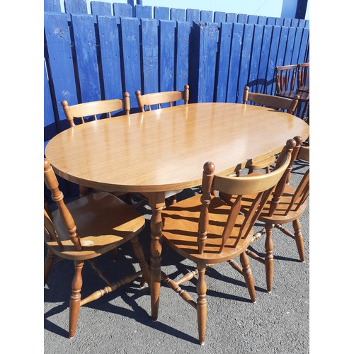 800A - AN OVAL OAK TABLE & 6 CHAIRS