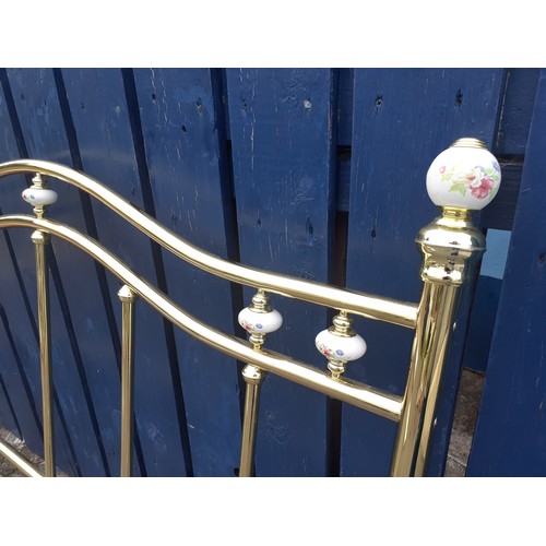 44 - A BRASS DOUBLE HEADBOARD WITH PORCELAIN BALLS