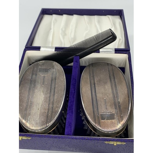 138 - A CASED TWIN BRUSH & COMB SET