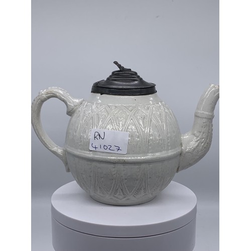 140 - AN ANTIQUE POTTERY TEAPOT WITH A PEWTER LID