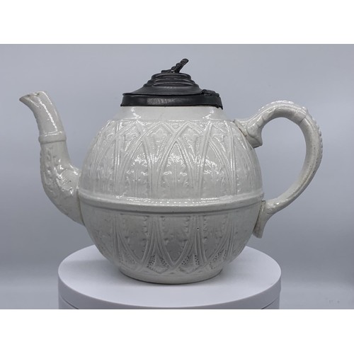 140 - AN ANTIQUE POTTERY TEAPOT WITH A PEWTER LID