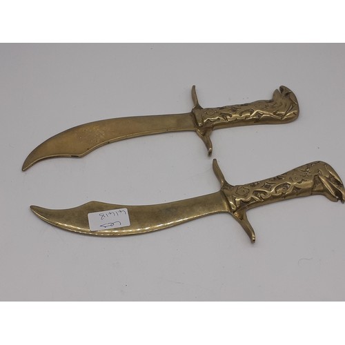 194 - PAIR OF BRASS DAGGERS 12