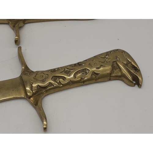 194 - PAIR OF BRASS DAGGERS 12