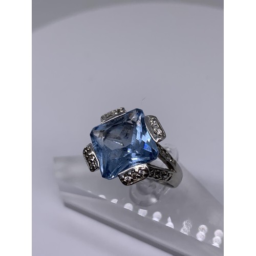 239 - SILVER LARGE SQUARE TOPAZ AND GEM SET RING