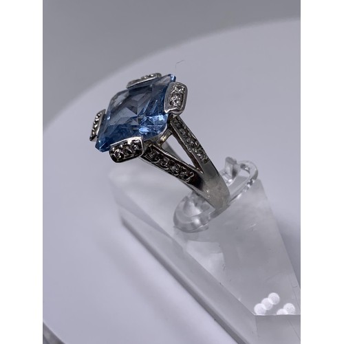 239 - SILVER LARGE SQUARE TOPAZ AND GEM SET RING