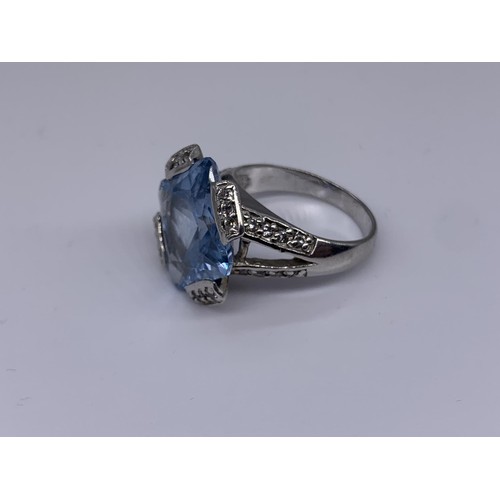 239 - SILVER LARGE SQUARE TOPAZ AND GEM SET RING