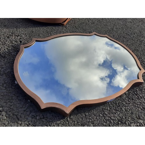 175 - A SHAPED COPPER FINISH FRAMED MIRROR 24X17