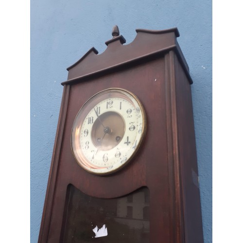 441 - AN OAK CASED CLOCK WITH BEVELLED GLASS FACE