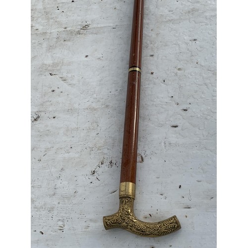 443 - BRASS HANDLED WALKING STICK WITH BRANDY TUBE