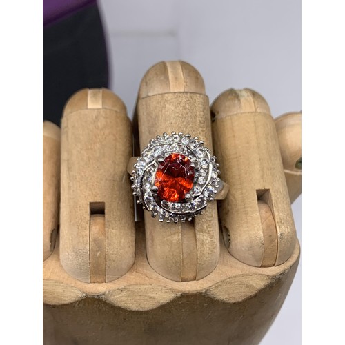 224 - DESIGNER SILVER GEM SET RING WITH LARGE RED STONE