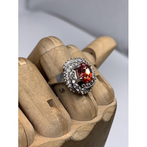 224 - DESIGNER SILVER GEM SET RING WITH LARGE RED STONE