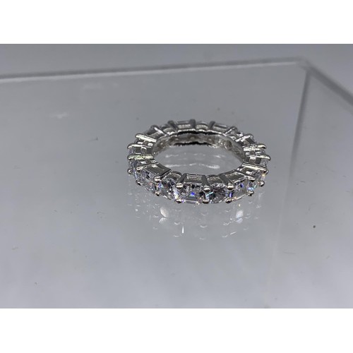 257 - A HEAVY SILVER DESIGNER STYLE GEM SET ETERNITY RING