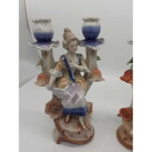 453 - PAIF OF FIGURINE CANDLE HOLDERS 9