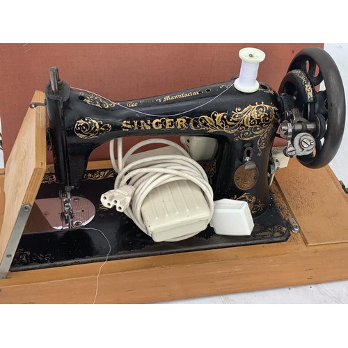 513 - CASED SEWING MACHINE