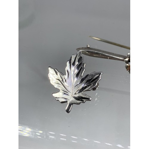 258 - 2 SILVER BROOCH AN ISLE OF MAN AND CANADIAN LEAF