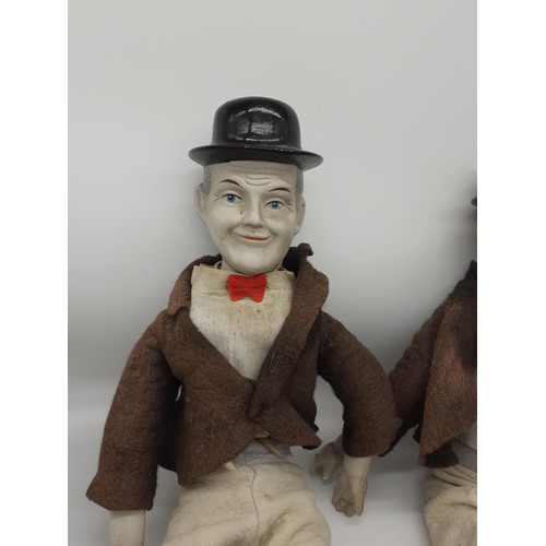 537 - LARGE LAUREL AND HARDY POPPET FIGURES WITH PORCELAIN FACES